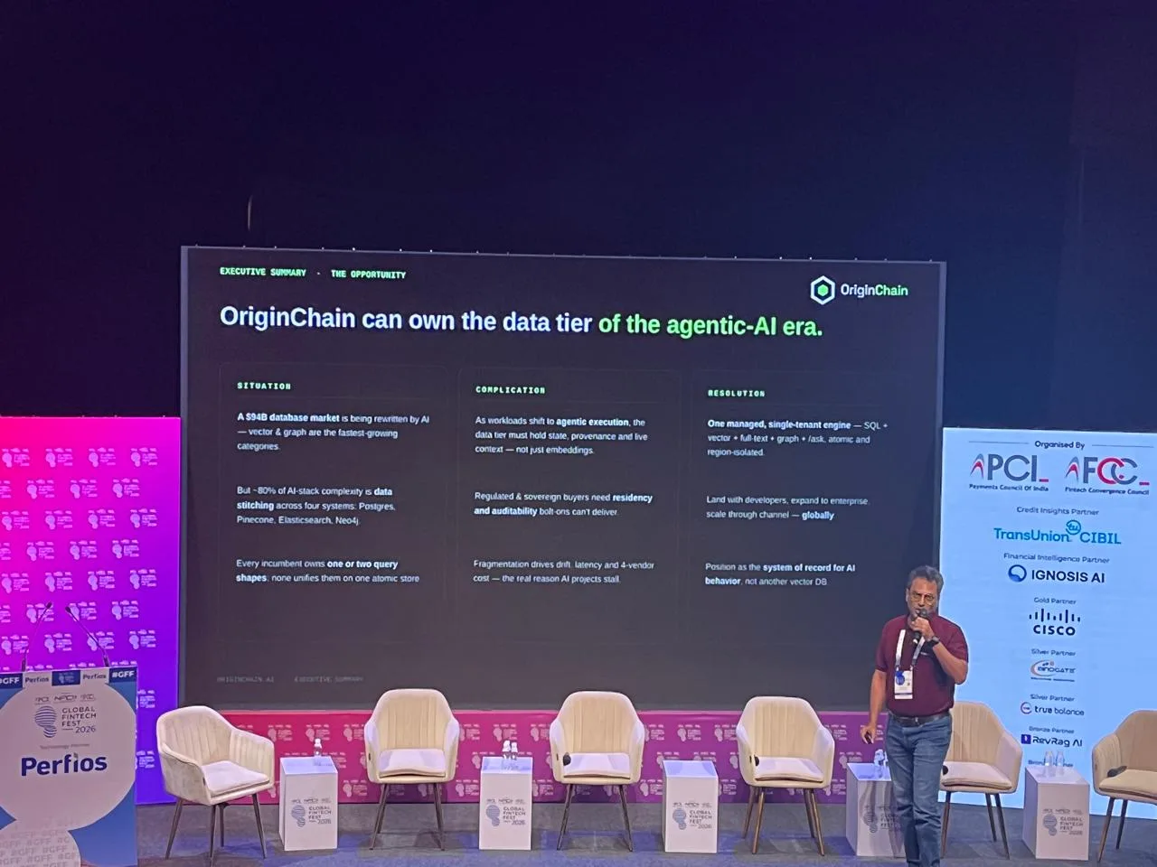 Wide view of the stage during the session, the audience-facing screen showing a slide about the data layer for agentic AI.
